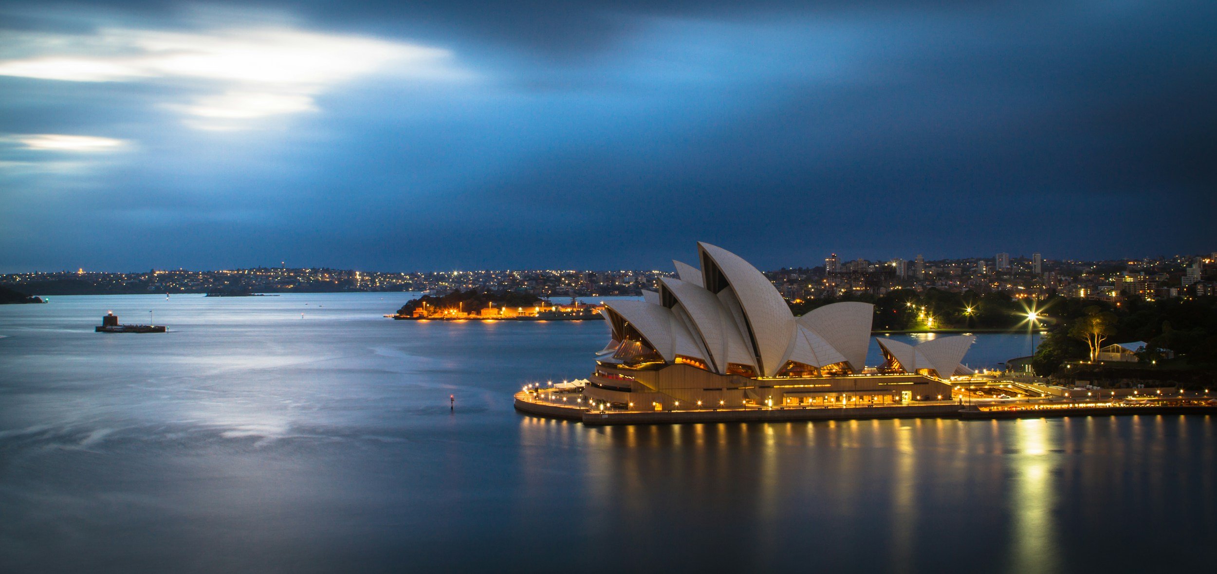 Sydney Opera House and harbour at dusk